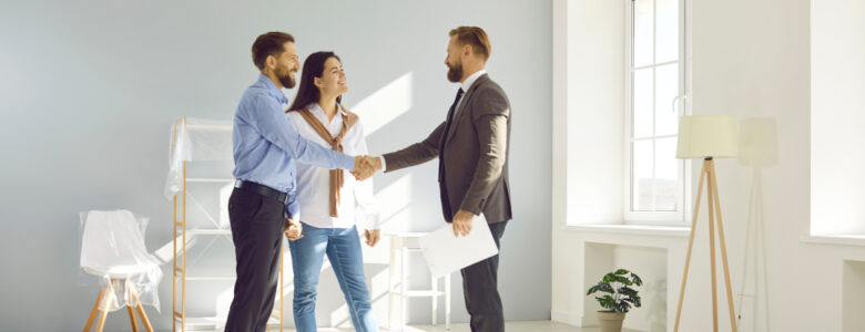 A couple meets with one of their builders' associates.